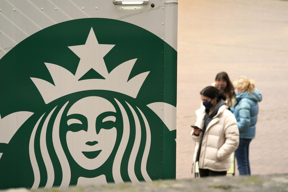 A Starbucks coffee truck continues to serve students and staff in an otherwise nearly deserted Red Square on the University of Washington campus Monday, Jan. 25, 2021, in Seattle. (AP Photo/Elaine Thompson)