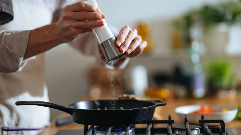 Adding salt to a pan