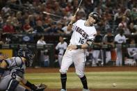 Arizona Diamondbacks' Tim Locastro (16) gets hit with a pitch as San Diego Padres catcher Luis Torrens, left, looks on during the fifth inning of a baseball game, Friday, Sept. 27, 2019, in Phoenix. (AP Photo/Ross D. Franklin)