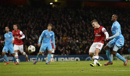 Arsenal's Jack Wilshere scores a goal against Olympique Marseille during their Champions League soccer match at the Emirates stadium in London November 26, 2013. REUTERS/Dylan Martinez