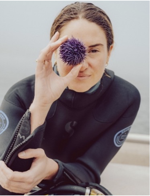 Shailene Woodley eyes a purple sea urchin.