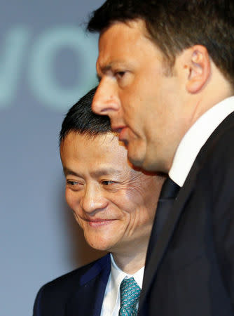 Founder and Executive Chairman of Alibaba Group Jack Ma (L) and Italy's Prime Minister Matteo Renzi arrive at the Vinitaly wine exhibition in Verona, Italy, April 11 2016. REUTERS/Stefano Rellandini