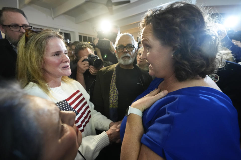 U.S. Rep. Katie Porter, D-Calif., a U.S. Senate candidate, right, talks to supporters at an election night party, Tuesday, March 5, 2024, in Long Beach, Calif. (AP Photo/Damian Dovarganes)