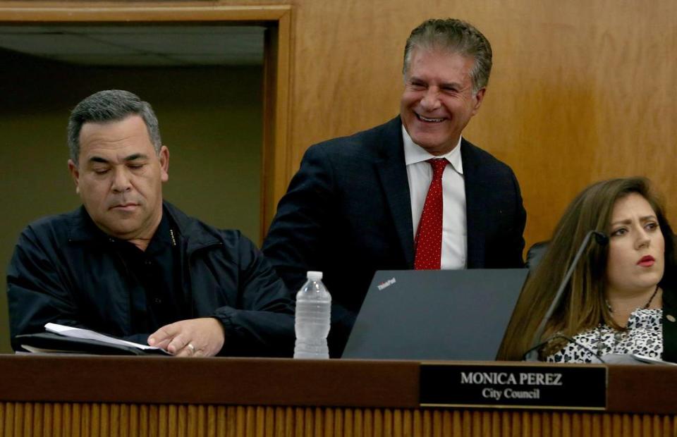 Hialeah Mayor Carlos Hernández walks by City Councilwoman Monica Perez and Police Chief Sergio Velázquez, during a City Council meeting on Tuesday, Jan. 28, 2020.