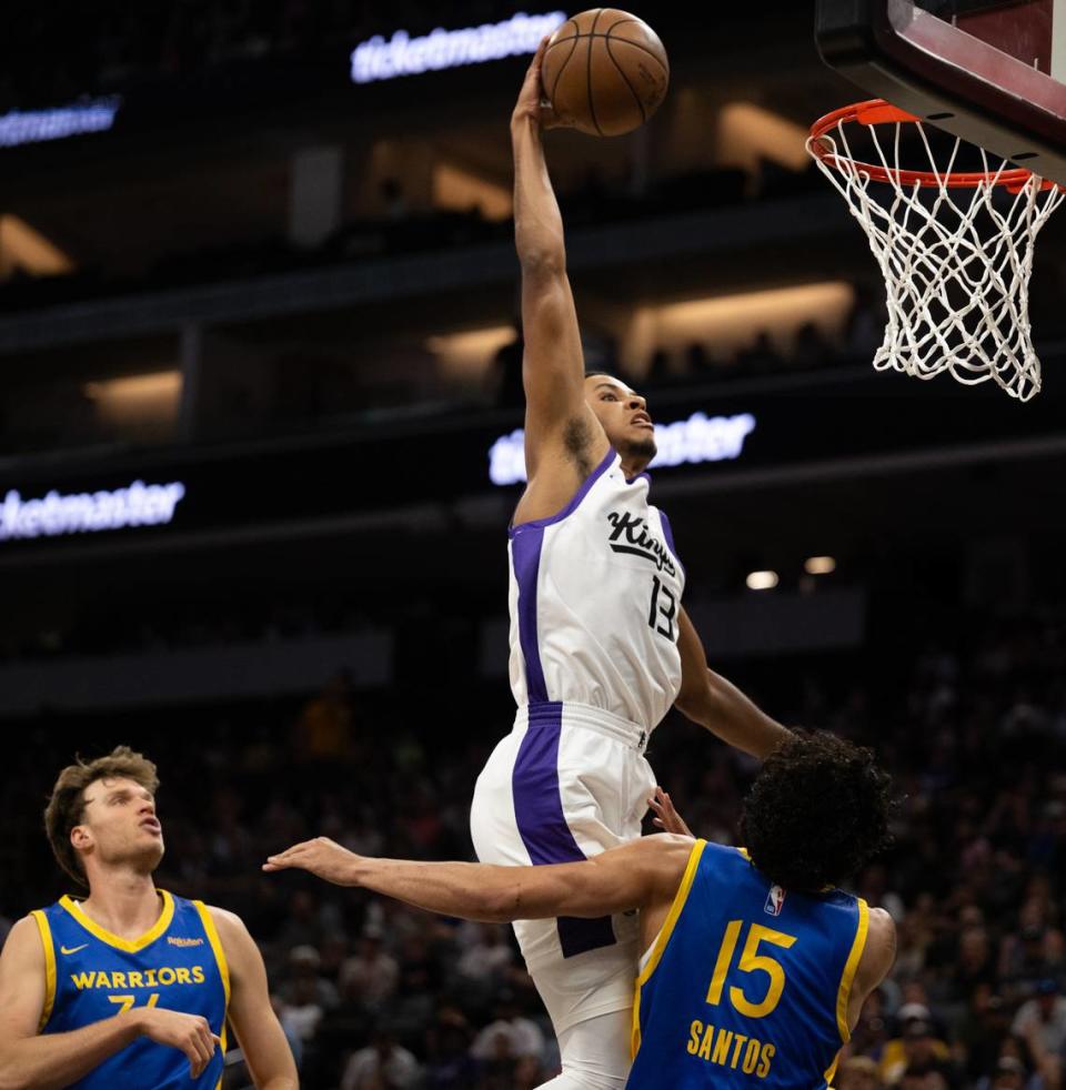 Sacramento Kings forward Keegan Murray dunks the ball over Golden State Warriors Gui Santos during the California Classic Summer League at Golden 1 Center Monday, July 3, 2023 in Sacramento.