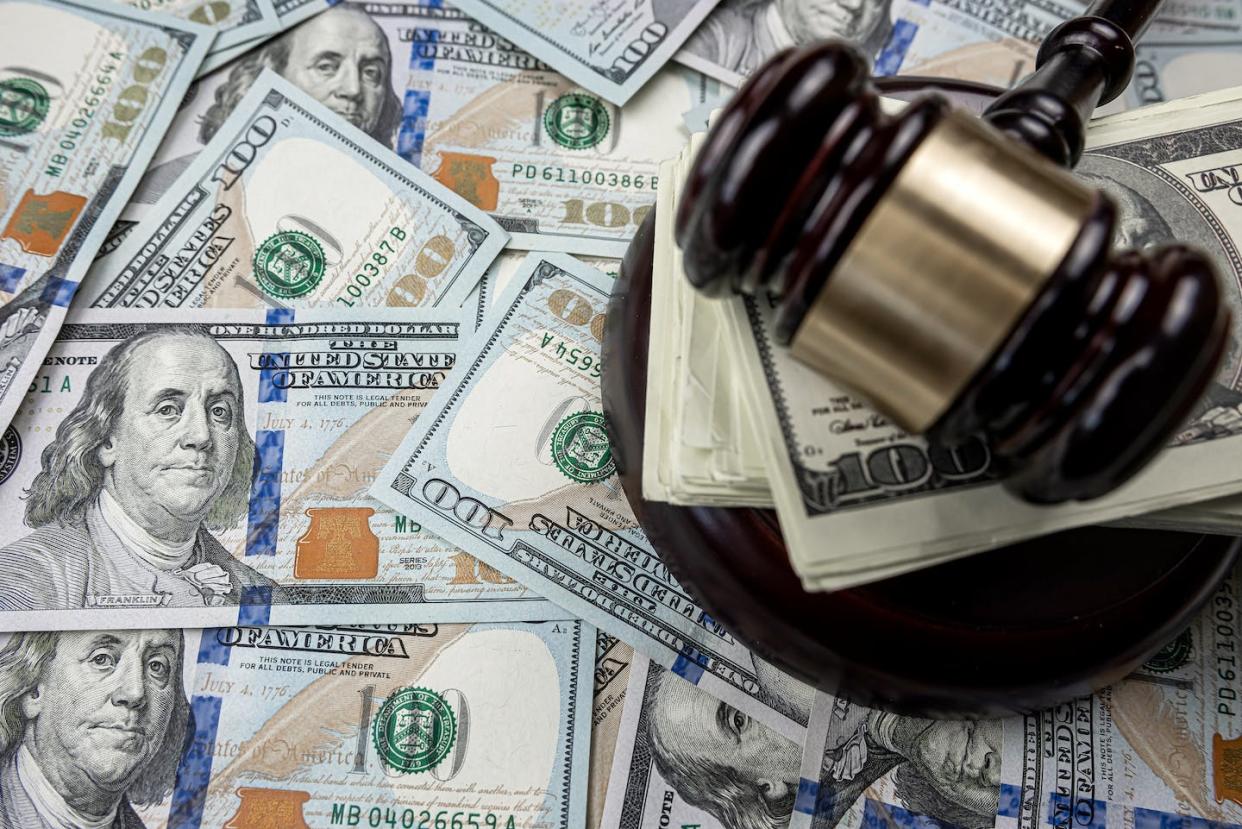 Several U.S. states are eliminating criminal fines and fees for people who can't afford them. <a href="https://www.gettyimages.com/detail/photo/dollars-bills-with-law-gavel-legal-issues-royalty-free-image/1479990448?phrase=excessive+courts+costs+US&adppopup=true" rel="nofollow noopener" target="_blank" data-ylk="slk:Getty Images;elm:context_link;itc:0;sec:content-canvas" class="link ">Getty Images</a>