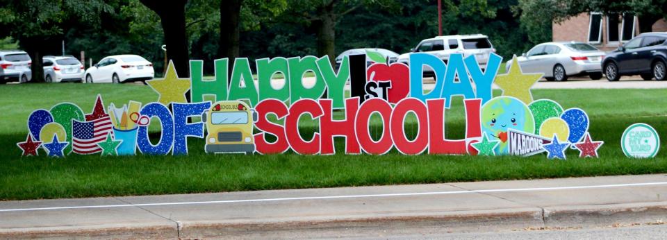 A sign in front of Holland Christian's Rose Park Elementary welcomes students back to school on the first day of the 2021-22 school year.