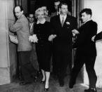 <p>Marilyn married Joe DiMaggio in January. They're coming out of the courthouse where the ceremony was held. </p>