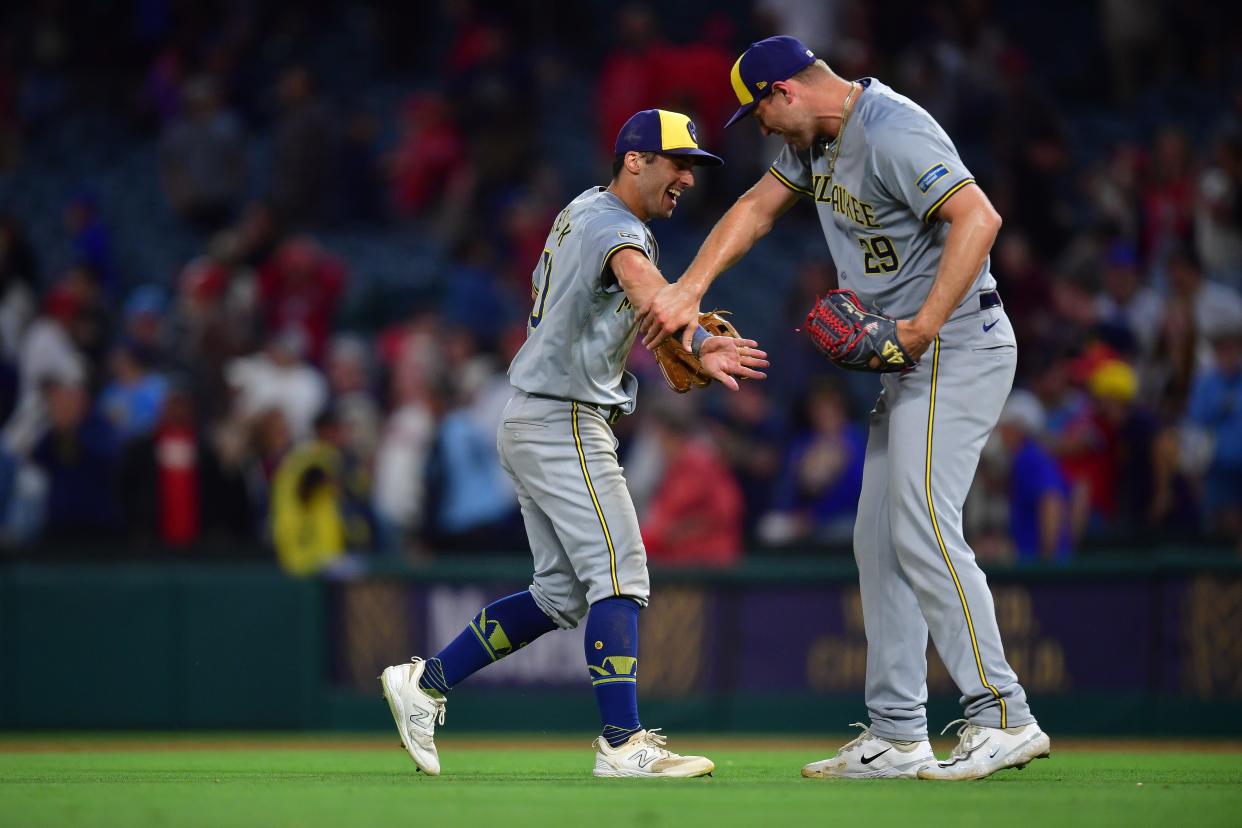 Brewers outfielder Sal Frelick, left, and pitcher Trevor Megill celebrate the victory Tuesday night.