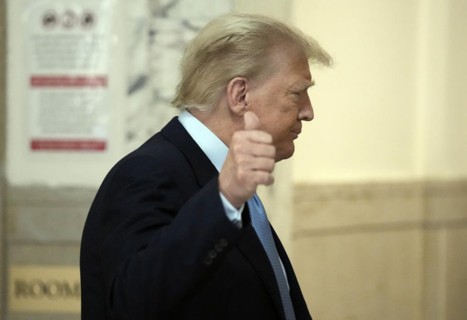 Former President Donald Trump returns to the courtroom after a break of his civil business fraud trial at New York Supreme Court, Wednesday, Oct. 18, 2023, in New York. (AP Photo/Seth Wenig)