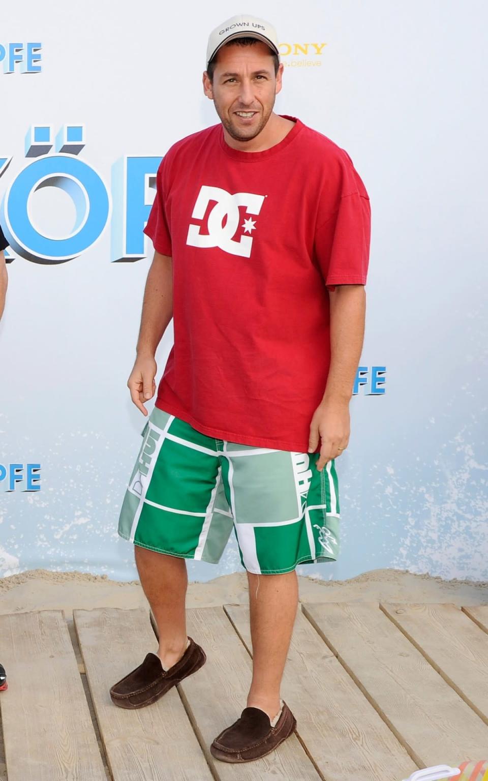 <p>Sandler broke out the board shorts (and slippers) to spread the word about <i>Grown Ups</i> in Berlin. (Photo: Toni Passig/WireImage)</p>