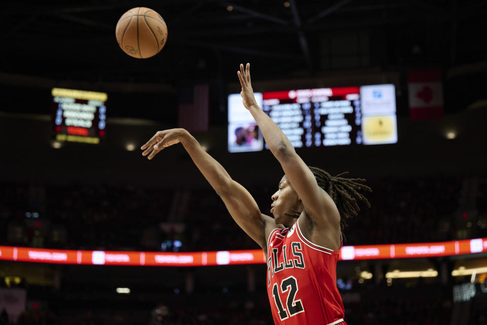 Chicago Bulls guard Ayo Dosunmu shoots a jump shot against the Portland Trail Blazers during the first half of an NBA basketball game in Portland, Ore., Sunday, Jan. 28, 2024. (AP Photo/Troy Wayrynen)