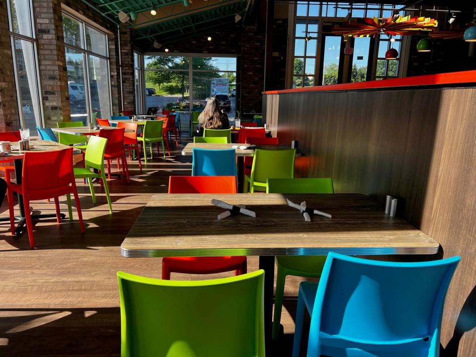 A sunlight shines through floor-to-ceiling windows at The Breakfast Club.