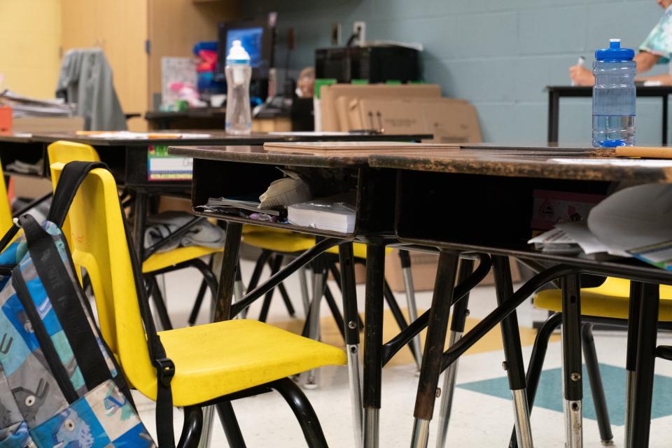 Traditional desks in a Ross Elementary fourth-grade classroom limit sight for teachers to see how students are using their cubby space compared to the open shelf of a standing desk.