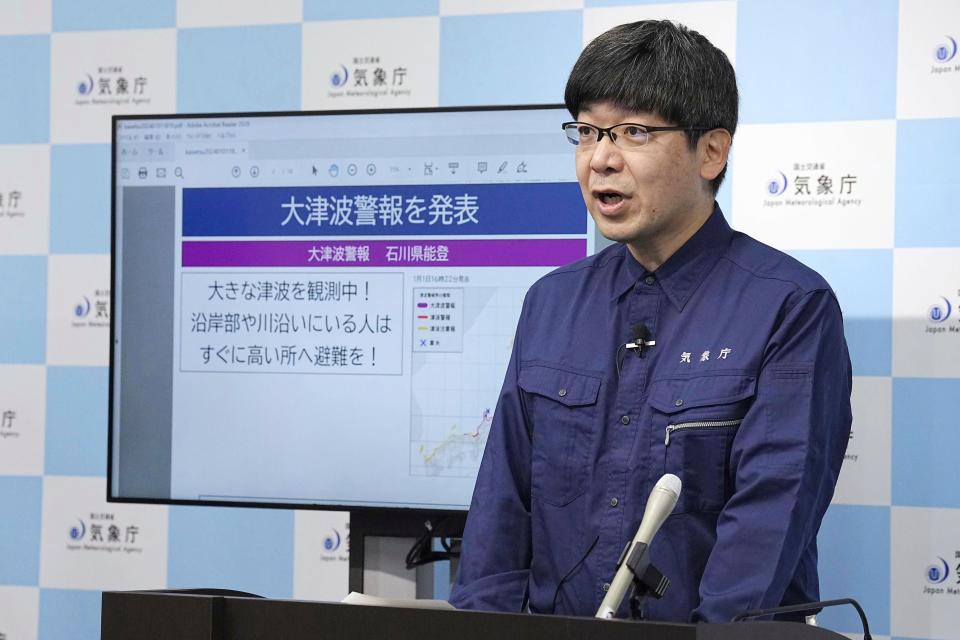 A staff member of Japan Meterological Agency speaks at a press conference in Tokyo Monday, Jan. 1, 2024, following an earthquake. Japan issued tsunami alerts and told people to evacuate seaside areas after a series of strong quakes on its western coastline Monday. (Kyodo News via AP)