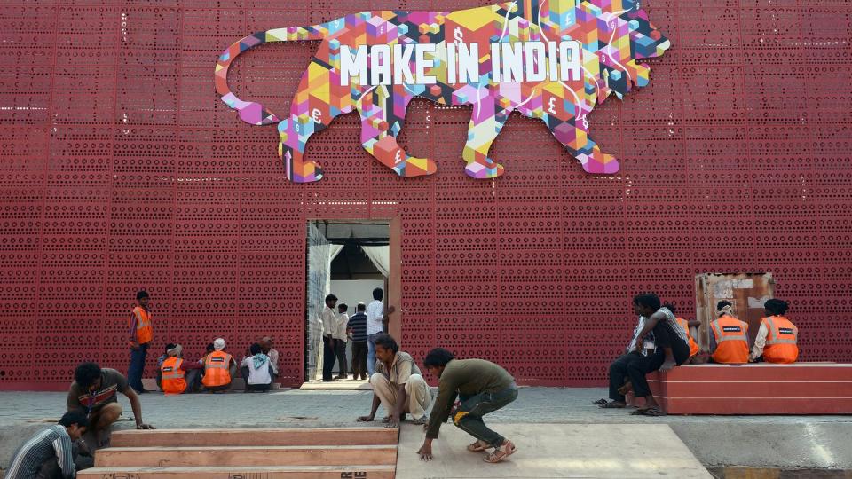 Indian workers set up the venue for a Make in India showcase in Mumbai on Feb. 11, 2016. (Indranil Mukherjee/AFP via Getty Images)