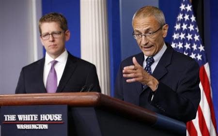 White House senior counselor John Podesta (R) speaks to reporters in the White House briefing room in Washington May 5, 2014. REUTERS/Kevin Lamarque