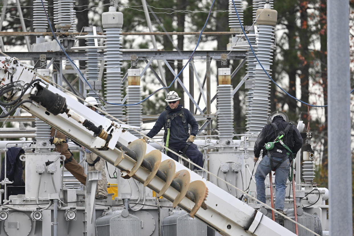 Personnel at work at a substation in Carthage, N.C., following a power outage on Dec. 5