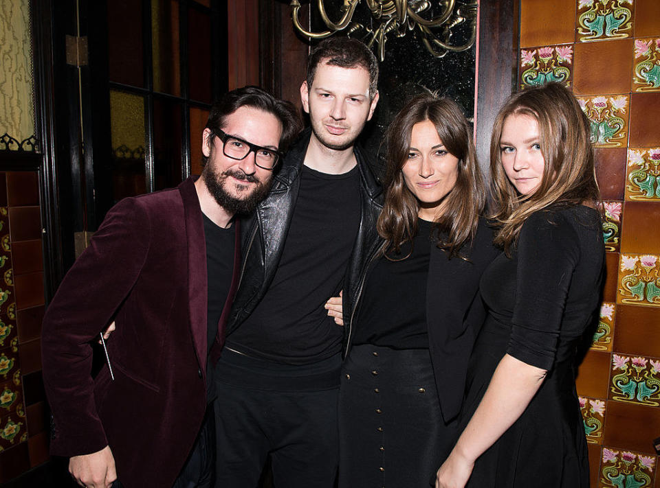 A group of people dressed in black at a party