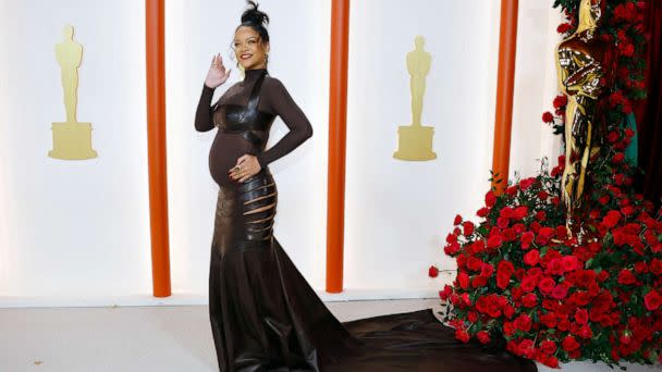 PHOTO: Rihanna poses on the champagne-colored red carpet during the Oscars arrivals at the 95th Academy Awards in Hollywood, March 12, 2023. (Eric Gaillard/Reuters)