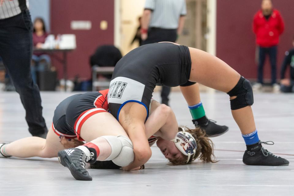 Excelsior’s Itzel Padilla escapes getting pinned by Big Bear’s Sequoia Dubuque during the 135 pound title match at the Desert Sky League Finals, hosted by Granite Hills High School, on Saturday, Jan. 20, 2024.