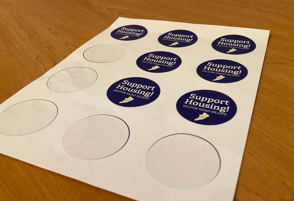 Stickers urging Hilton Head islanders to support the town’s affordable housing efforts were available at Town Hall during Tuesday’s meeting. At the meeting, the town council approved the new affordable housing framework.