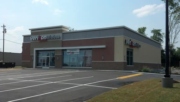 Verizon Wireless store with empty parking lot.