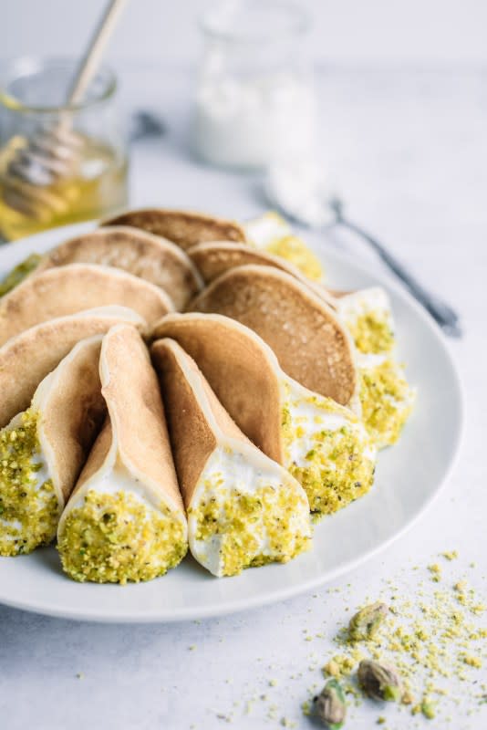 <p>Qatayef Asafiri is a delicious, fragrant and beautiful Arabian pancake stuffed with sweet cheese filling and ground pistachios. A great addition to your pancake repertoire!</p><p><strong>Get the recipe: <a href="https://www.gastrosenses.com/blog/sweet-cheese-qatayef-asafiri/" rel="nofollow noopener" target="_blank" data-ylk="slk:Sweet Cheese Qatayef Asafiri;elm:context_link;itc:0;sec:content-canvas" class="link ">Sweet Cheese Qatayef Asafiri</a></strong></p>