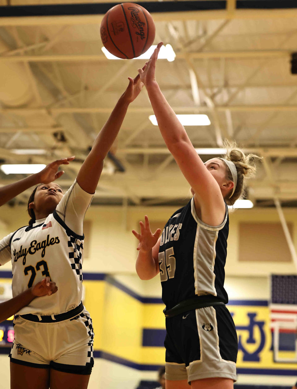 West Clermont's Anna Swisshelm (35) shoots over Walnut Hills Cylee Leggett (23). Swisshelm and the Wolves are 20-0.