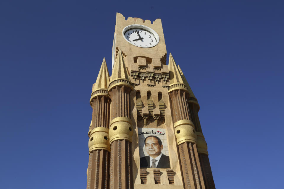 A clocktower shows Egyptian President Abdel Fattah el-Sissi ahead of this year’s United Nations global summit on climate change, known as COP27, in the Old Market of Sharm el-Sheikh, South Sinai, Egypt, Thursday, Nov. 3, 2022. As this year’s United Nations climate summit approaches, Egypt’s government is touting its efforts to make Sharm el-Sheikh a more eco-friendly tourist destination. (AP Photo/Thomas Hartwell)