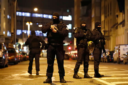 French special police forces secure an area during a police operation where the suspected gunman, Cherif Chekatt, who killed three people at a Christmas market in Strasbourg, was killed, in the Meinau district in Strasbourg, France, December 13, 2018. REUTERS/Christian Hartmann .