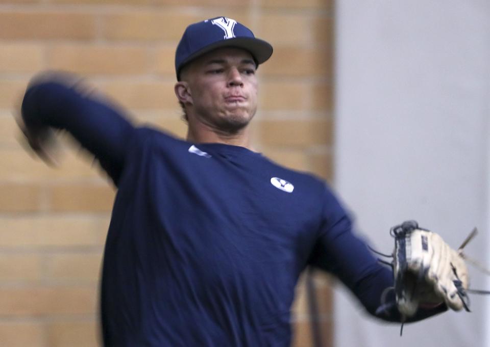 BYU quarterback Jaren Hall warms his arm up as he tosses the ball during baseball practice at the indoor facility on the BYU campus in Provo on Wednesday, Feb. 13, 2019. | Steve Griffin, Steve Griffin, Deseret News