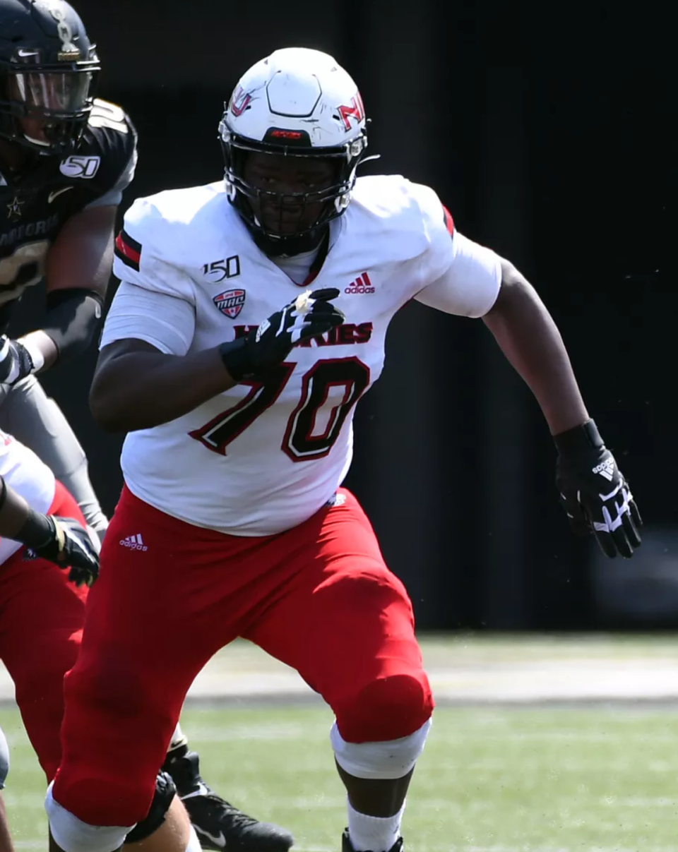 Peoria High graduate Marques Cox blocks for a runner during a game with Northern Illinois.