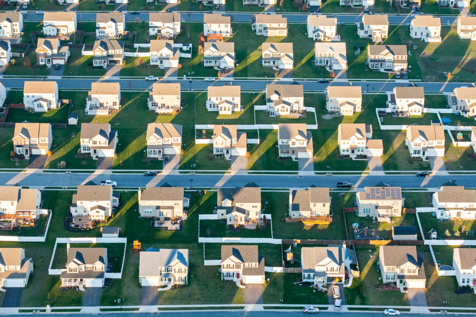 An oblique aerial view of suburban houses.