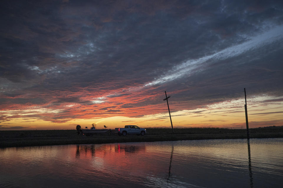 A sport fisherman leaves Pointe Aux Chenes in Terrebonne Parish ahead of Hurricane Delta on Wednesday, Oct. 7, 2020. Delta could make landfall, possibly as a Category 3 storm, sometime Friday south of Morgan City, La. (David Grunfeld/The Times-Picayune/The New Orleans Advocate via AP)