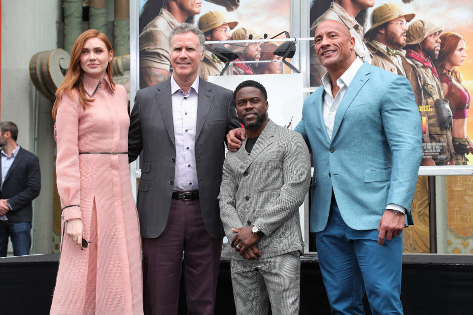 HOLLYWOOD, CALIFORNIA - DECEMBER 10: Kevin Hart (C) poses with Karen Gillan (L) Will Ferrell (2L) and Dwayne Johnson Hand And Footprint Ceremony honoring Kevin Hart at TCL Chinese Theatre on December 10, 2019 in Hollywood, California. (Photo by Leon Bennett/WireImage)