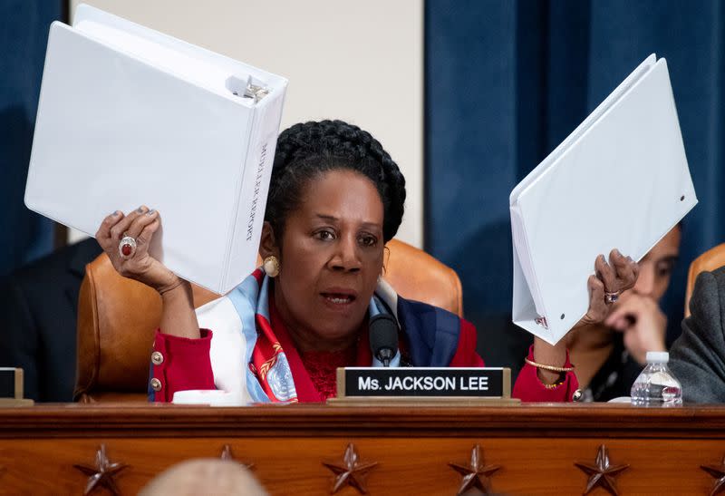 U.S. Representative Sheila Jackson Lee holds up copies of the Mueller Report as she questions constitutional scholars during a House Judiciary Committee hearing on the impeachment Inquiry into U.S. President Donald Trump on Capitol Hill