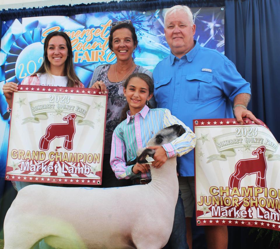 Sophia Zambanini of Somerset sold her grand champion lamb for $25 a pound to B.J. Maurer of Boswell during the livestock sale at the Somerset County Fair on Saturday. She is shown with her mother, Emily Zambanini, and her grandparents, Lisa and Matt Maurer, who own B.J. Maurer.
