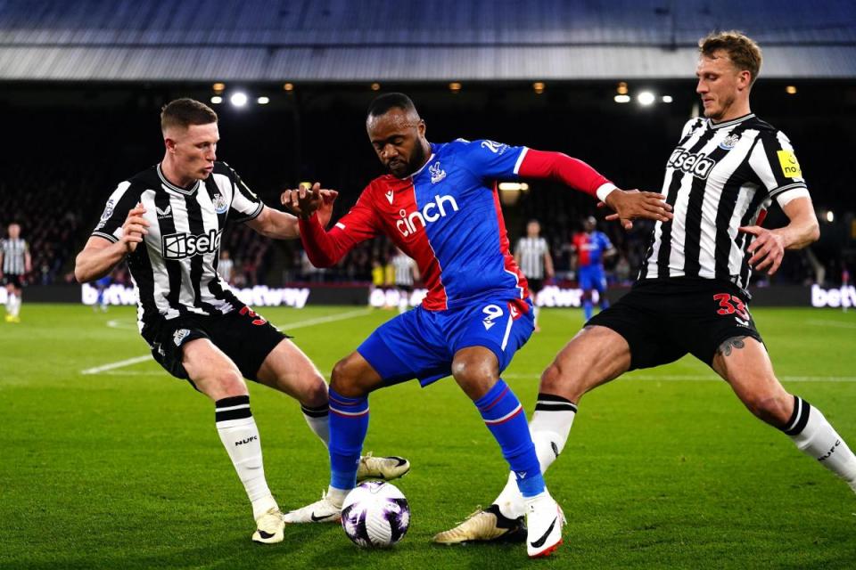 Jordan Ayew shields the ball from Elliot Anderson and Dan Burn <i>(Image: PA)</i>