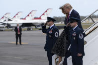 President Donald Trump, accompanied by first lady Melania Trump, arrives Air Force One at Daytona Beach International Airport, Sunday, Feb. 16, 2020, in Daytona Beach, Fla. Trump is en route to the NASCAR Daytona 500 auto race at Daytona International Speedway. (AP Photo/Alex Brandon)