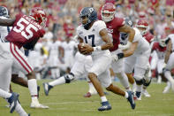 Georgia Southern quarterback Justin Tomlin (17) runs the ball against Arkansas during the first half of an NCAA college football game Saturday, Sept. 18, 2021, in Fayetteville, Ark. (AP Photo/Michael Woods)