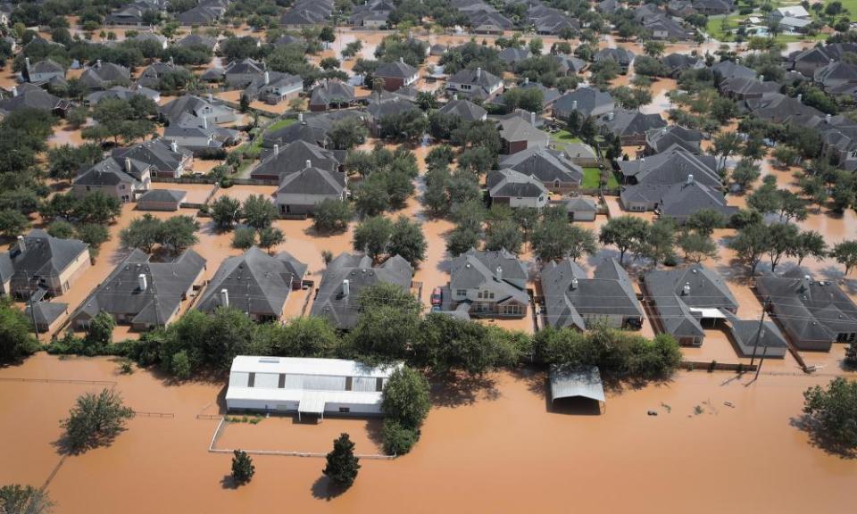 Homes are surrounded by floodwater after torrential rains pounded Southeast Texas following Hurricane and Tropical Storm Harvey on August 31, 2017 in Sugar Land, Texas.