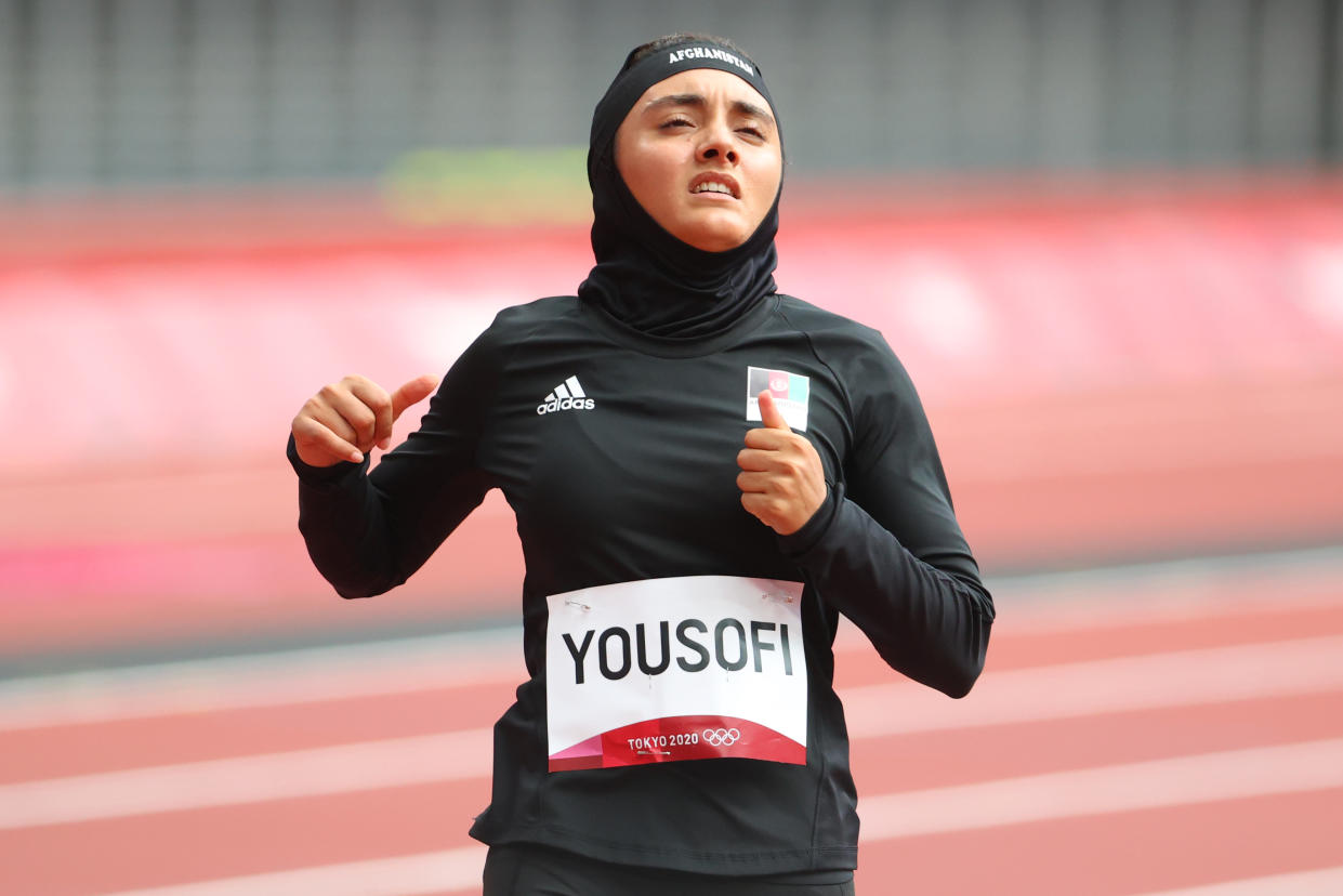 TOKYO, JAPAN - JULY 30: Kimia Yousofi of Team Afghanistan reacts after her performance during the Women's 100 meter preliminary round on day seven of the Tokyo 2020 Olympic Games at Olympic Stadium on July 30, 2021 in Tokyo, Japan. (Photo by Abbie Parr/Getty Images)