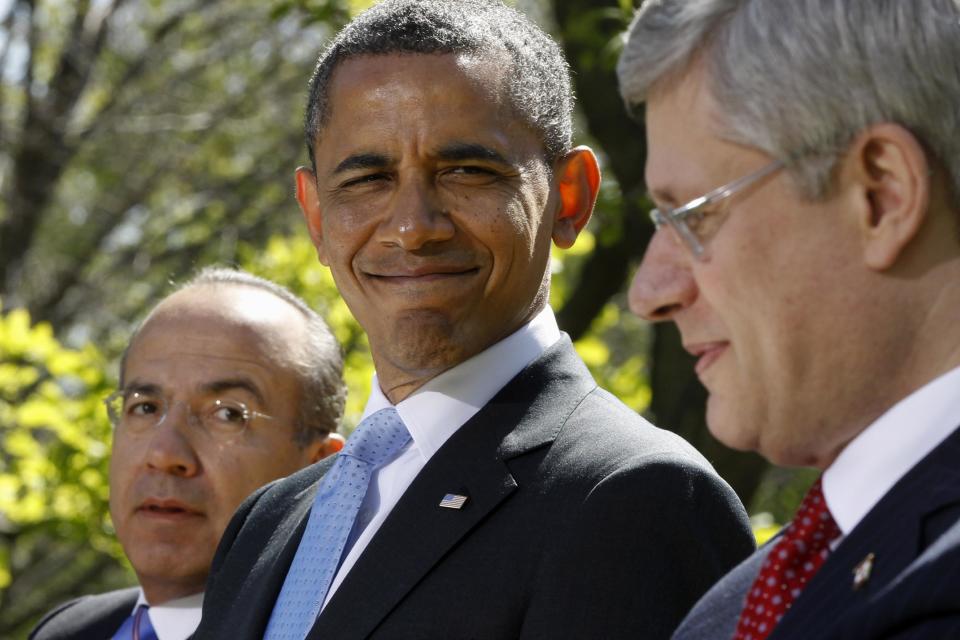 President Barack Obama, Mexico's President Felipe Calderon, and Canada's Prime Minister Stephen Harper participate in a joint news conference in the Rose Garden at the White House in Washington, Monday, April 2, 2012. (AP Photo/Charles Dharapak)