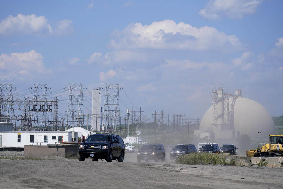 The motorcade for President Joe Biden arrives for an event at Brayton Power Station, Wednesday, July 20, 2022, in Somerset, Mass. (AP Photo/Evan Vucci)