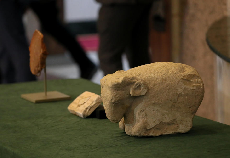 Antiquities recovered from the United States are displayed at the Ministry of Foreign Affairs in Baghdad, Iraq, Tuesday, Dec. 7, 2021. (AP Photo/Khalid Mohammed)