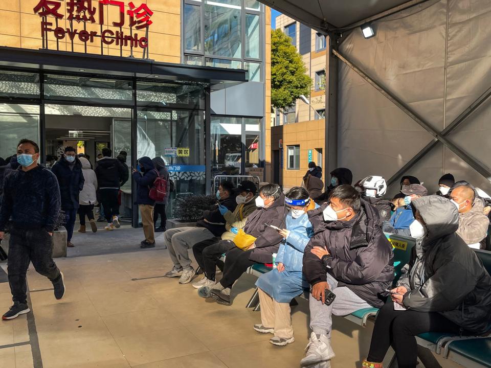 People wait for medical attention at the Fever Clinic area in Tongren Hospital in the Changning district in Shanghai, on December 23, 2022.