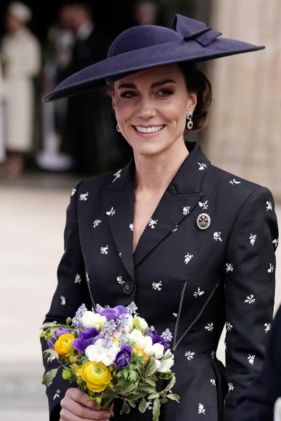 The Princess wore a ‘jaunty yet elegant’ navy saucer hat - Getty