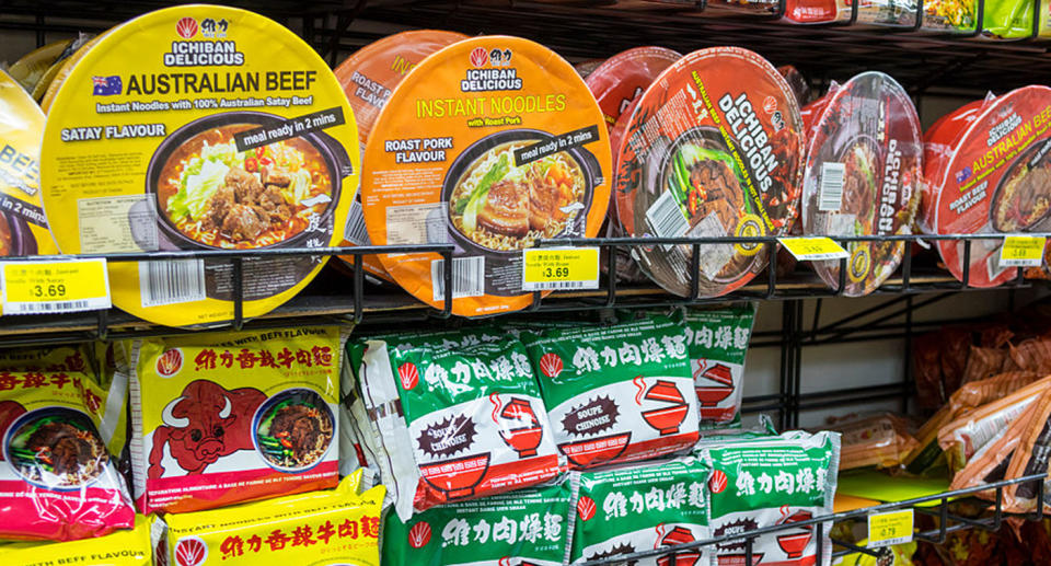 Instant noodles seen on a supermarket shelf.