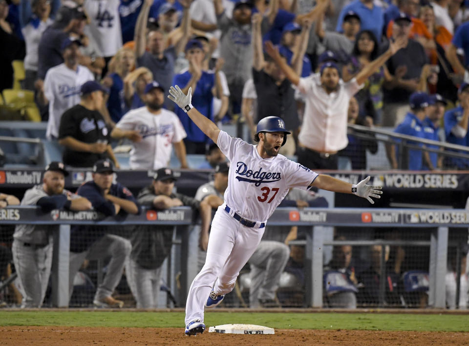 The Dodgers’ Charlie Culberson celebrates after hitting a home run against the Astros in the 11th inning. (AP)